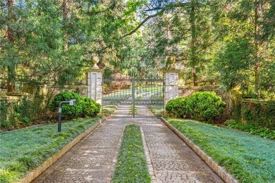 Hidden beyond a gated, winding drive in the heart of - photo 9