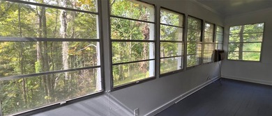 This cozy 1-bed, 1-bath updated camp house offers a serene - photo 12