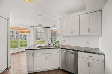 FIRST-FLOOR CONVENIENCE! NEWER A/C UNIT, STUNNING STONE - photo 9
