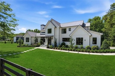 Nestled on 1.34 beautifully landscaped and fully fenced acres in - photo 1
