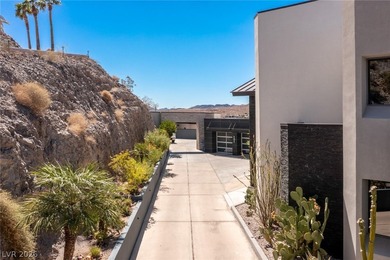 Perched on a prime .52 acre hillside estate overlooking Lake - photo 9
