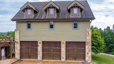 Perched to maximize its panoramic Dale Hollow Lake views, this - photo 4