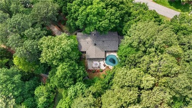 Tucked among mature trees on a large private lot in the - photo 1