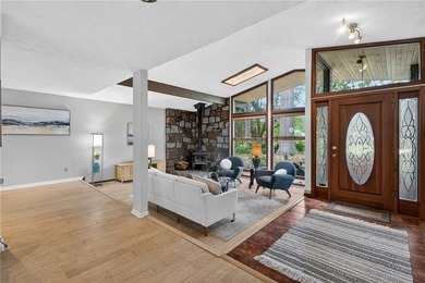 Tucked among mature trees on a large private lot in the - photo 4