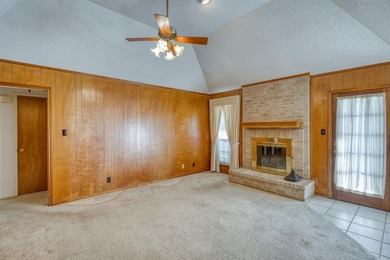 Opportunity awaits in this quaint brick home with a tile roof - photo 3
