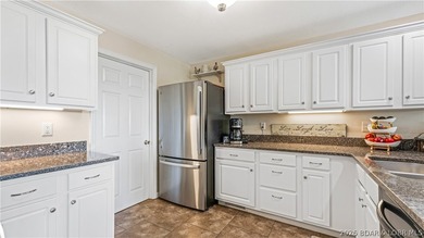 Walk-in, no steps, attached garage, lake views, and very low - photo 12