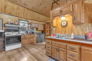 Enjoy lakeside living with this charming and move-in ready cabin - photo 3