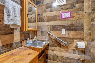 Enjoy lakeside living with this charming and move-in ready cabin - photo 9