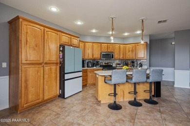 Welcome to this beautifully maintained 2,002 sq ft home nestled