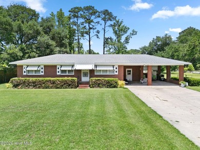 Charming, well-maintained brick home situated on a rare .79-acre - photo 1