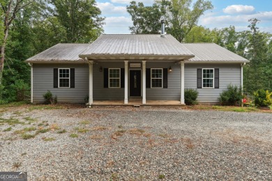 Lake Home For Sale in Gillsville, Georgia