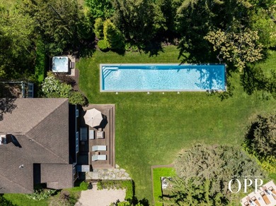 A cedar-shingled Bellport original set on approximately .62 acre - photo 4