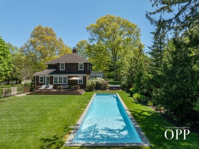 A cedar-shingled Bellport original set on approximately .62 acre - photo 8