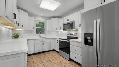 Lakefront living at its finest! This updated 4-bedroom, 3-bath - photo 12