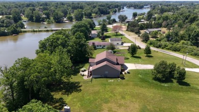 Welcome to this stunning two-story waterfront home in the highly - photo 3