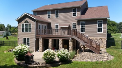 Welcome to this stunning two-story waterfront home in the highly - photo 4