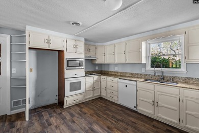 Enjoy peaceful country living on 2.07 private acres at 336 Muddy