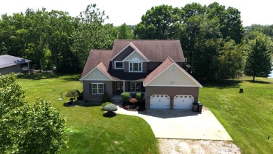 Welcome to this stunning two-story waterfront home in the highly - photo 1