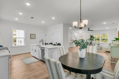 Located on a beautiful homesite of over a quarter acre in the - photo 11