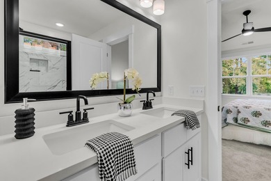 Located on a beautiful homesite of over a quarter acre in the - photo 19