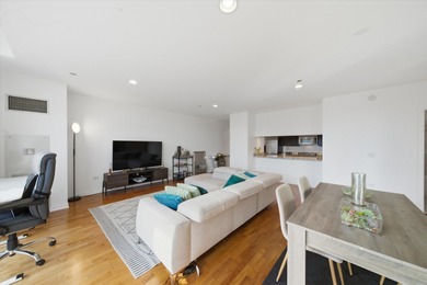 Perched on the 27th floor, this expansive one-bedroom, one-bath