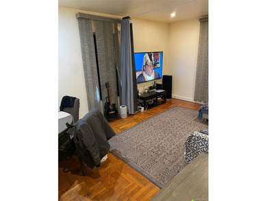 Renovated 1-bedroom, 1-bath co-op featuring a bright living and - photo 2