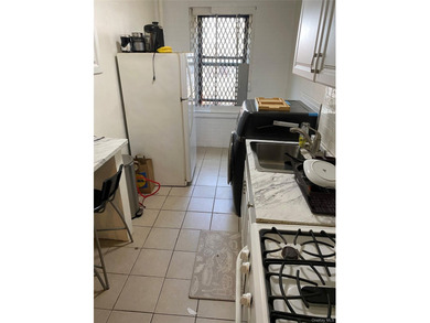 Renovated 1-bedroom, 1-bath co-op featuring a bright living and - photo 6