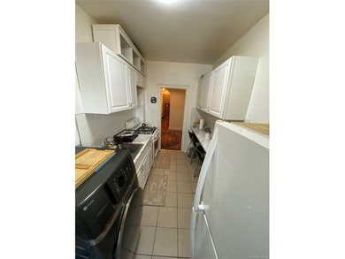 Renovated 1-bedroom, 1-bath co-op featuring a bright living and - photo 8