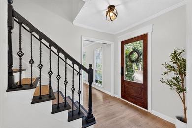 Tucked into a private wooded lot with a stunning lake view in - photo 13