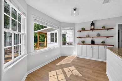 Tucked into a private wooded lot with a stunning lake view in - photo 15