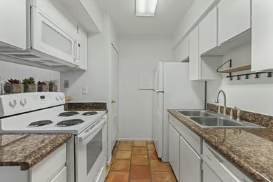 Welcome to Lakewood Village! This charming end-unit condo offers - photo 6