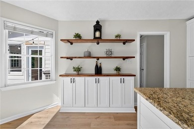Tucked into a private wooded lot with a stunning lake view in - photo 21