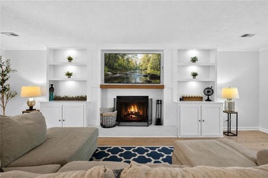Tucked into a private wooded lot with a stunning lake view in - photo 23
