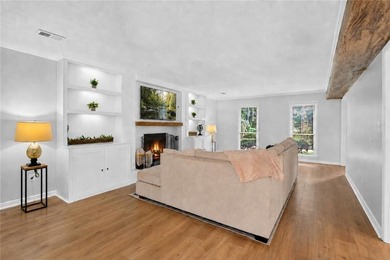 Tucked into a private wooded lot with a stunning lake view in - photo 25