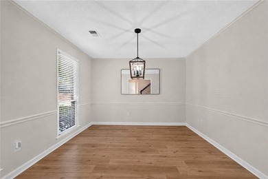 Tucked into a private wooded lot with a stunning lake view in - photo 26