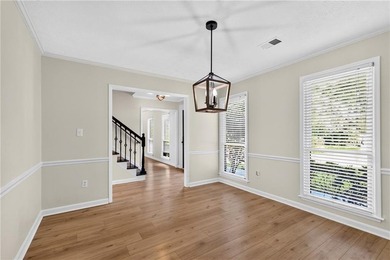 Tucked into a private wooded lot with a stunning lake view in - photo 27