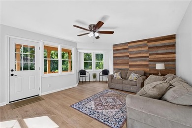 Tucked into a private wooded lot with a stunning lake view in - photo 28