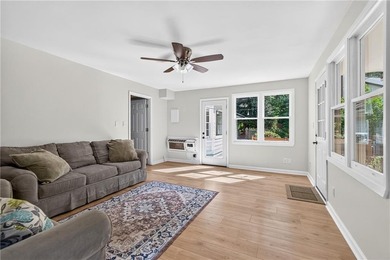 Tucked into a private wooded lot with a stunning lake view in - photo 29