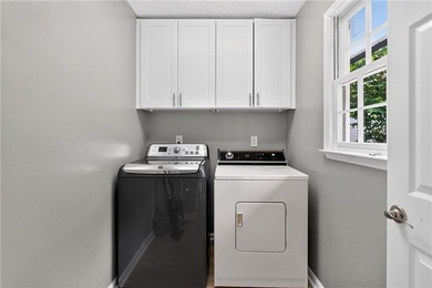 Tucked into a private wooded lot with a stunning lake view in - photo 31