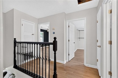 Tucked into a private wooded lot with a stunning lake view in - photo 32