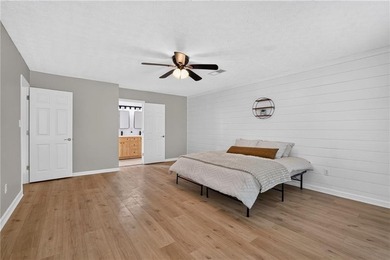 Tucked into a private wooded lot with a stunning lake view in - photo 33