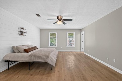 Tucked into a private wooded lot with a stunning lake view in - photo 34
