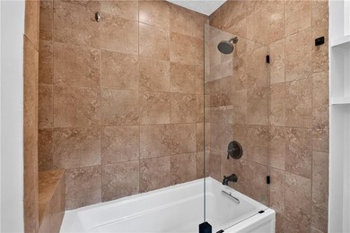 Tucked into a private wooded lot with a stunning lake view in - photo 37