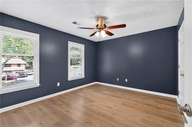 Tucked into a private wooded lot with a stunning lake view in - photo 39