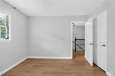 Tucked into a private wooded lot with a stunning lake view in - photo 42
