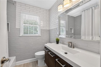 Tucked into a private wooded lot with a stunning lake view in - photo 43