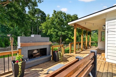 Tucked into a private wooded lot with a stunning lake view in - photo 45