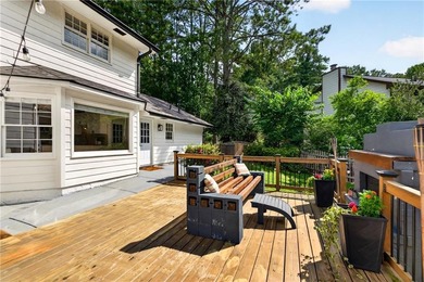 Tucked into a private wooded lot with a stunning lake view in - photo 46