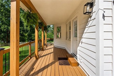 Tucked into a private wooded lot with a stunning lake view in - photo 47