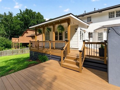 Tucked into a private wooded lot with a stunning lake view in - photo 48